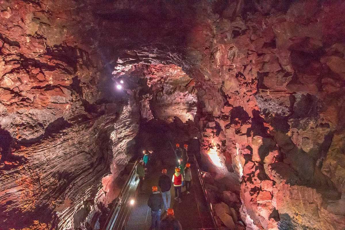 People visiting the Raufarholshellir lava tube tunnel and caves, one of the longest in Iceland.