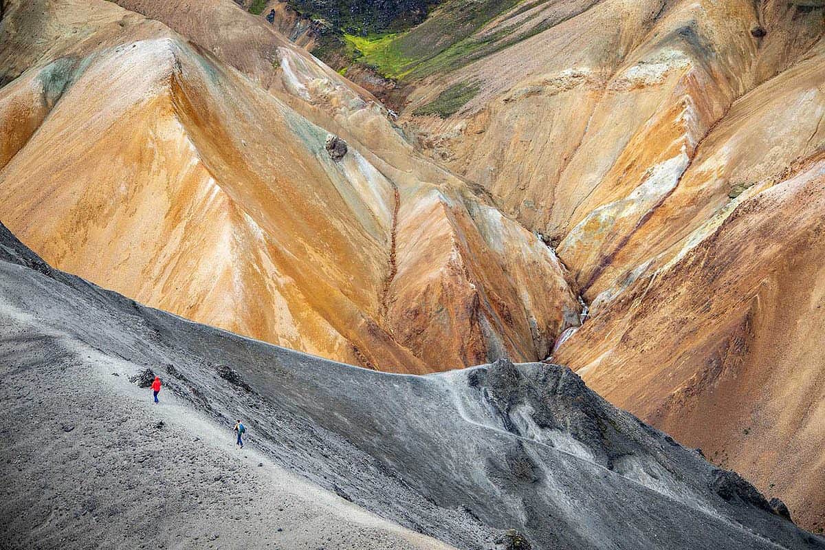 Tony figure hiking through colourful mountains on the Laugavegur Trail