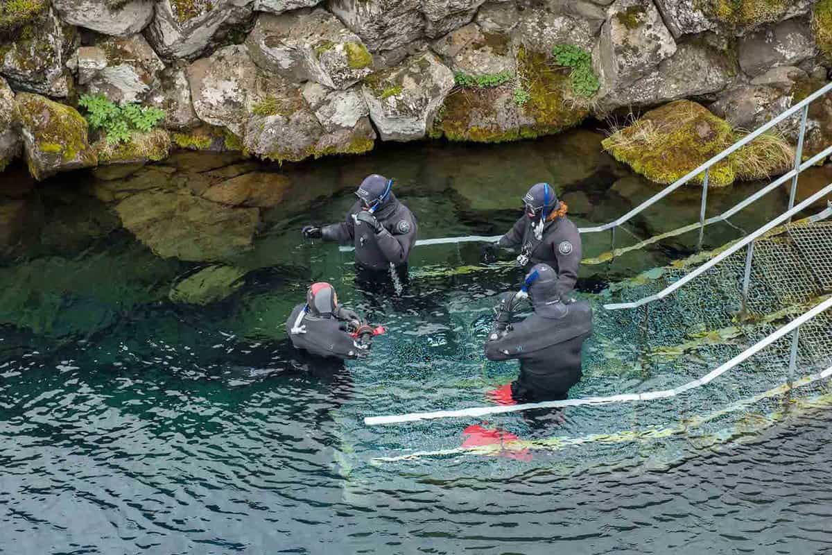 Divers and snorkellers entering the Silfa Rift
