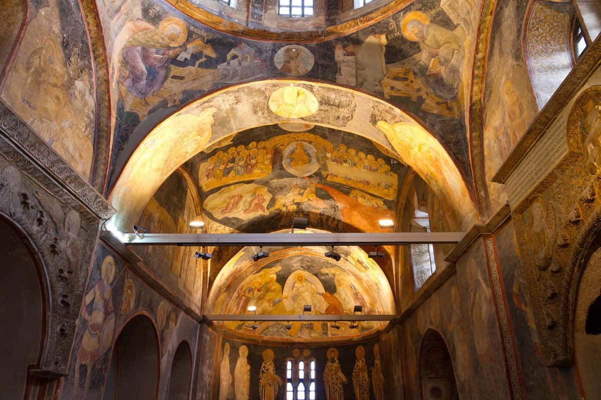 Gold-tiled interior of Turkish church with religious frescos