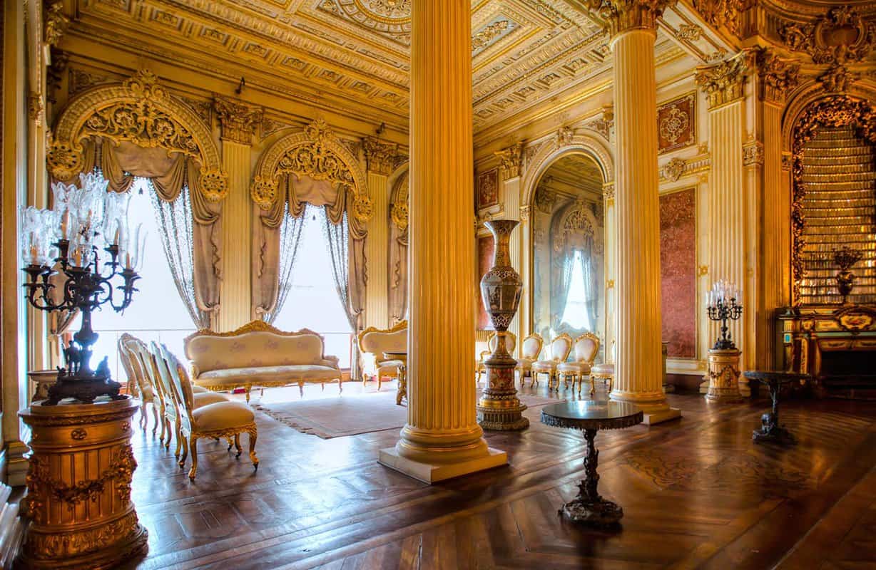 Opulent interior of palace with sun streaming in through windows