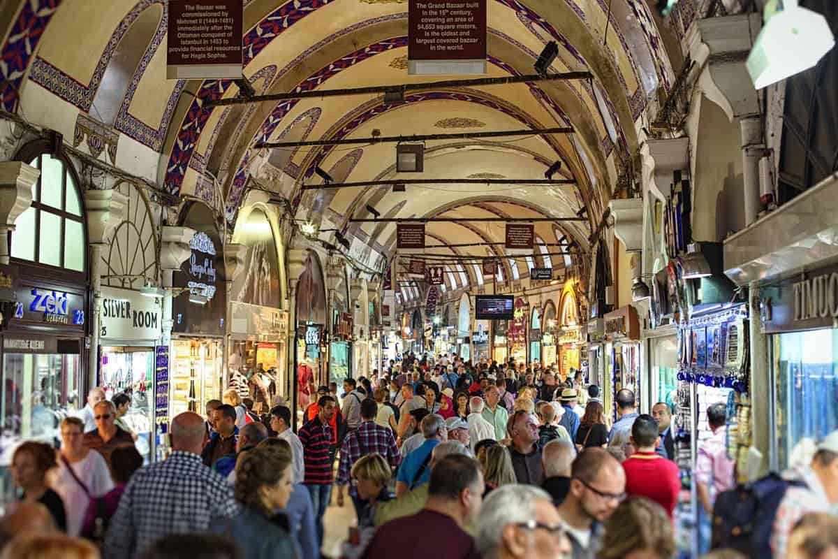 View down crowded, covered market lined with small shops