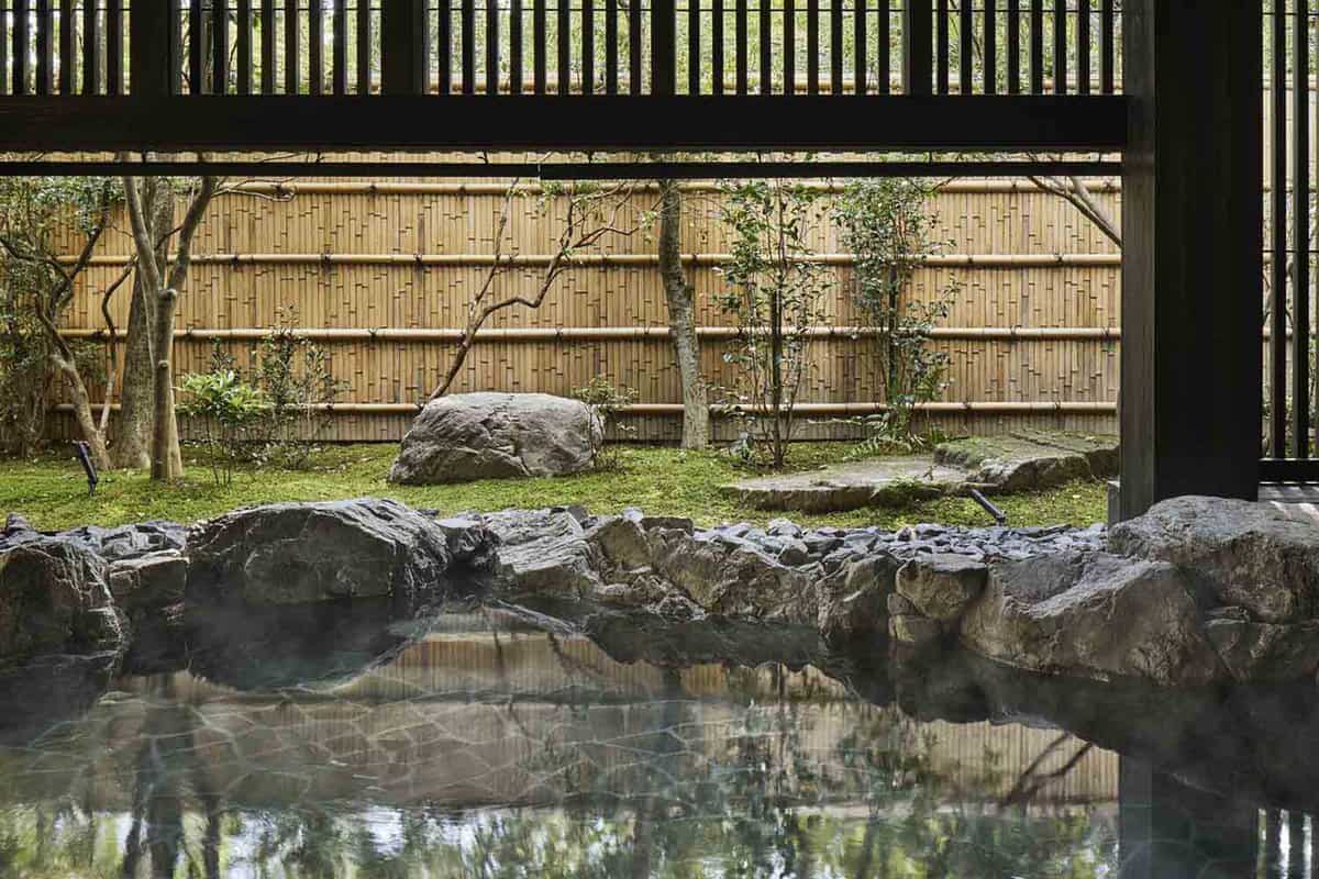 Covered onsen spa in fenced garden