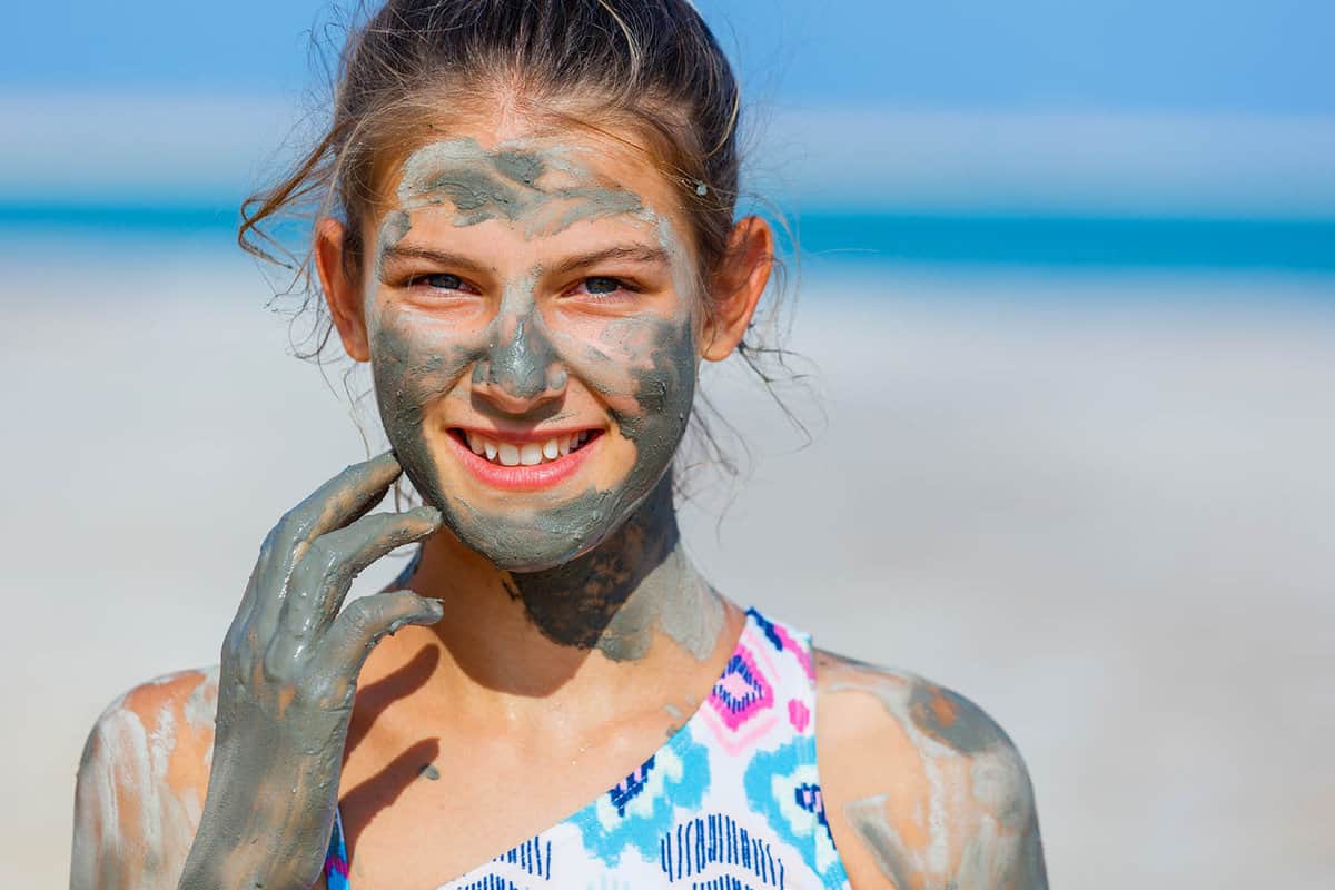 close up of a girl with Dead Sea mud on her face