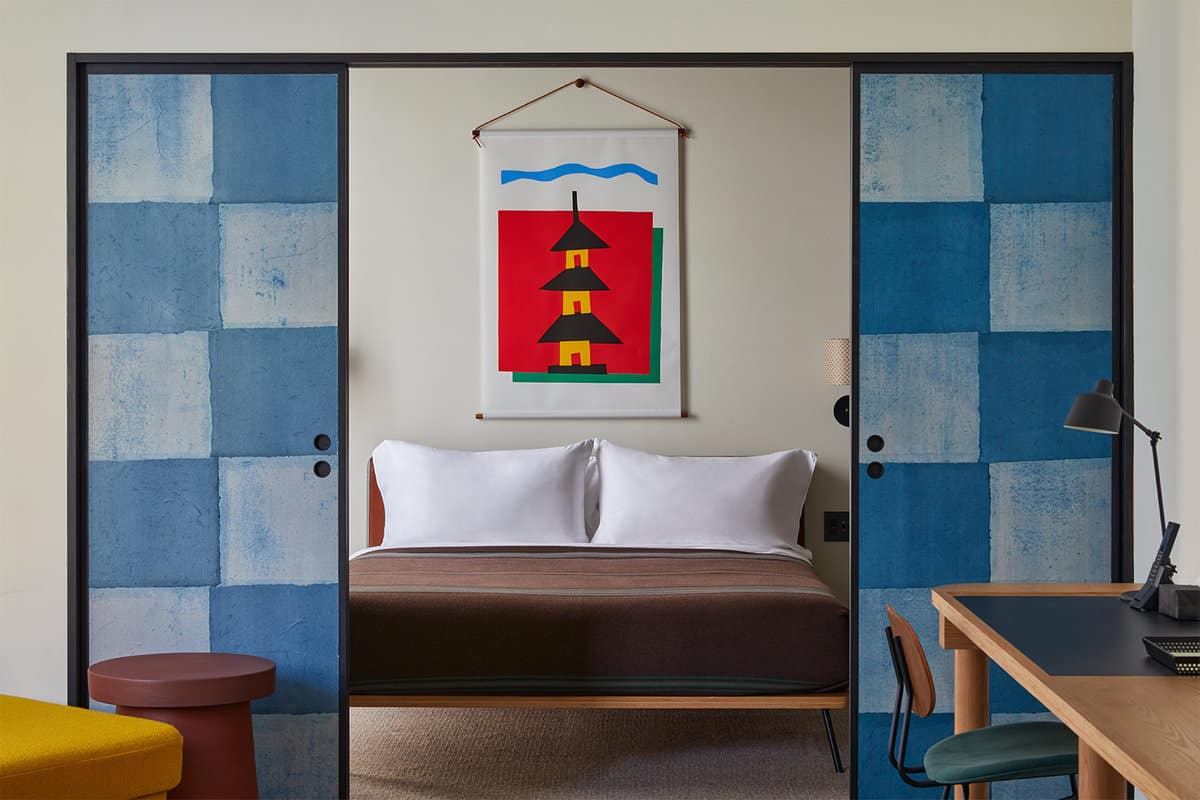 double bedroom through colourful shoji slides