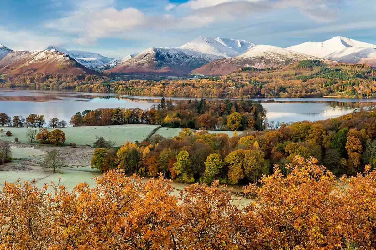 Beautiful view of Derwentwater in the English Lake District on a frosty Autumn morning with snow on the fells.