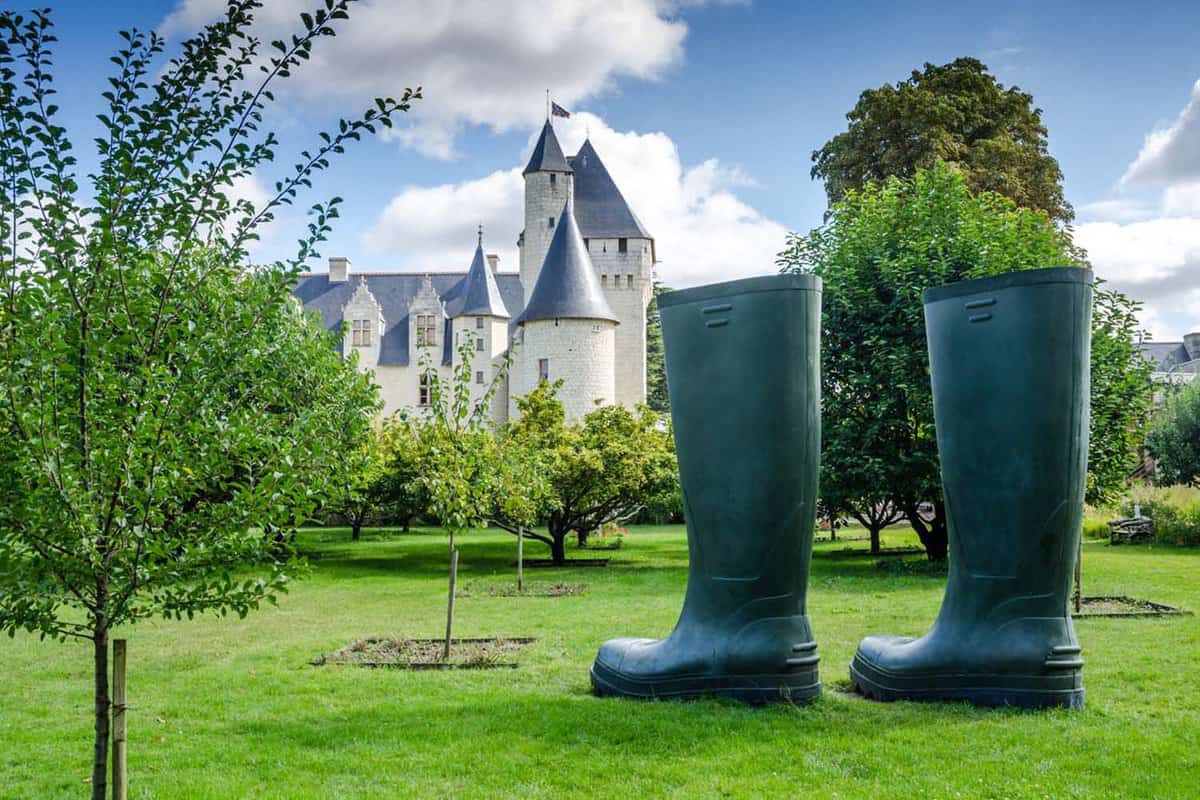 Two giant wellington boots statues in the chateau gardens