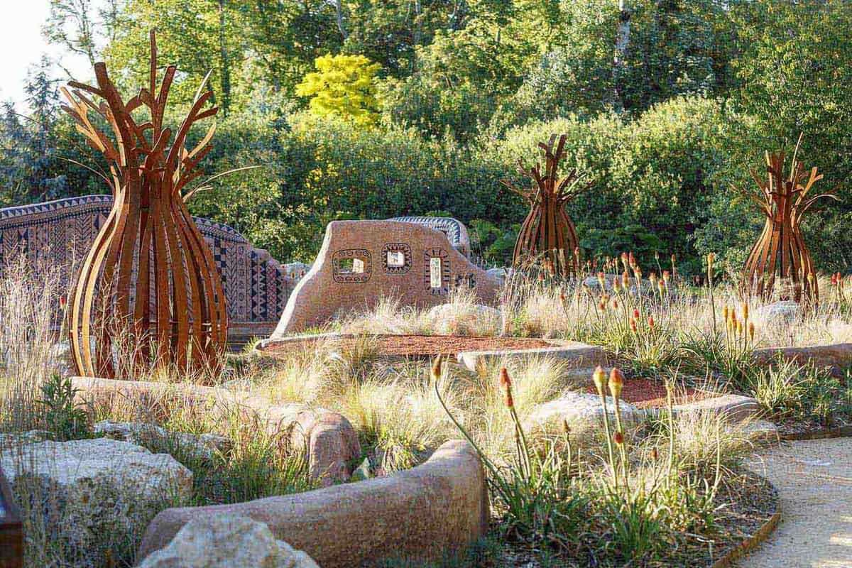 Modern art garden with rust coloured sculptured trees