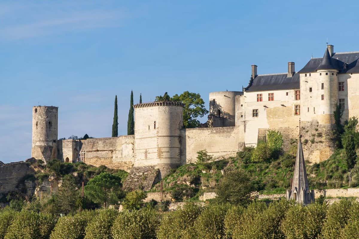 Landscape view of Chinon Fortress on a rocky spur during a summery blue day