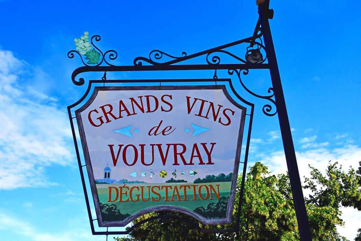 Wine merchant sign hanging from a lamp post