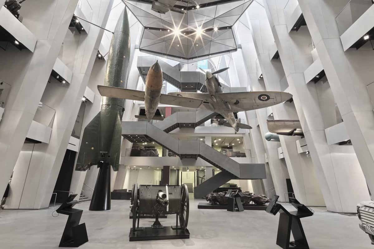 view of the main entrance hall of the museum with planes and rockets hanging from the ceiling