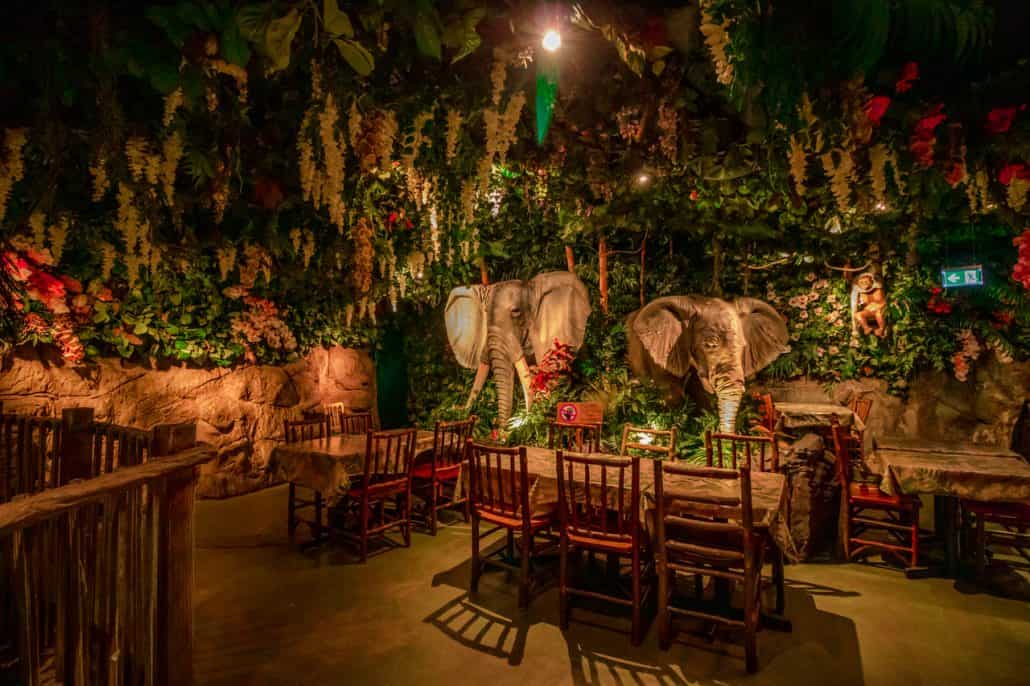Interior of Jungle Cave restaurant showing rainforest ceiling and model elephants