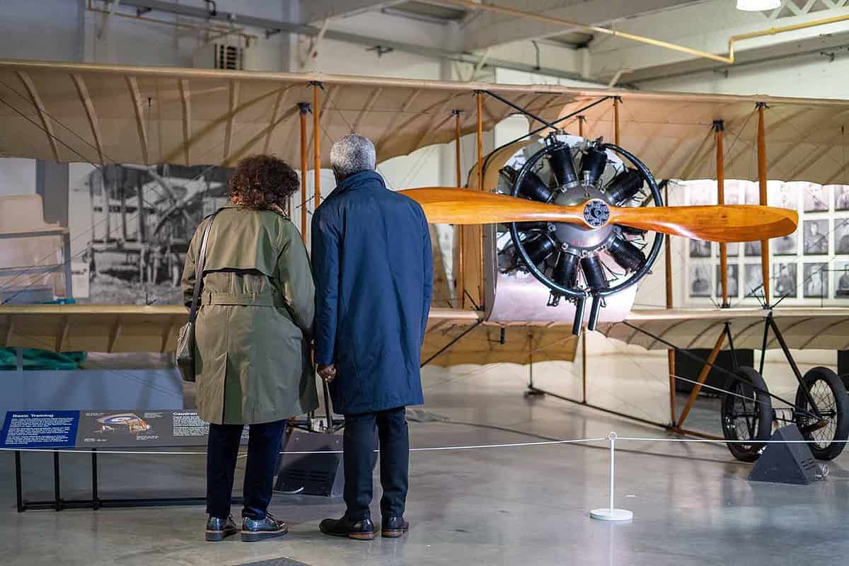 elderly couple inspecting an old plane at Royal Air Force Museum