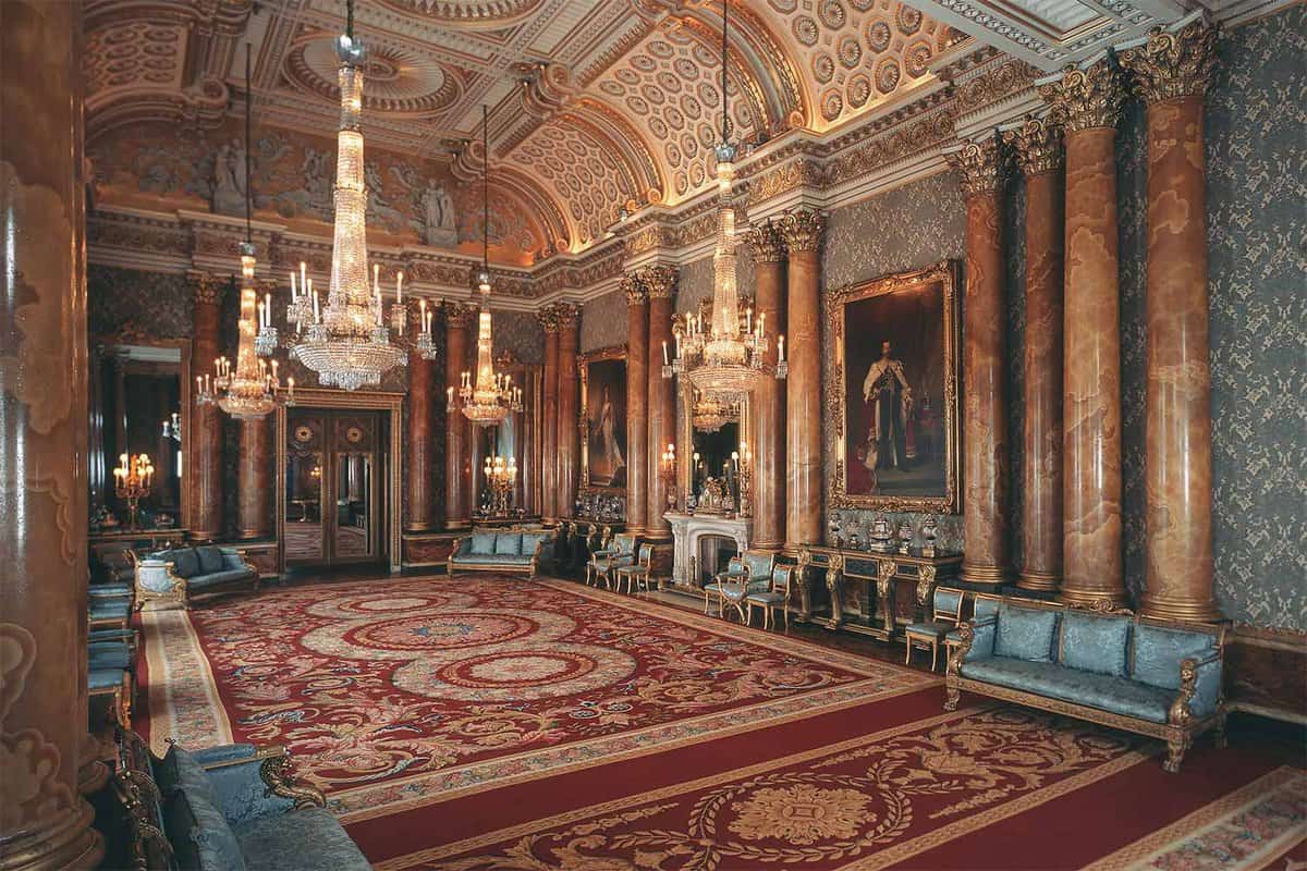 Lavish and ornate room decorated with gold and paintings on the wall
