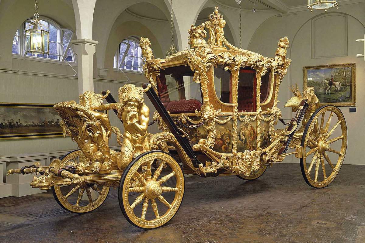 A sophisticated State Coach inside the building