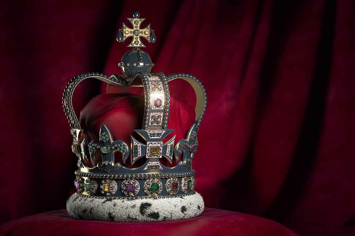 View of a crown sitting on a red velvet cushion