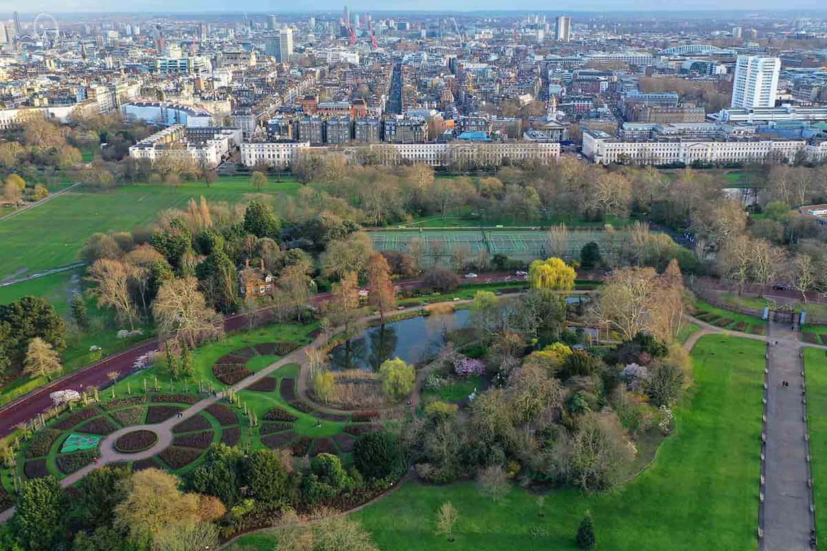 Birds eye view of a park bordering a city in the daytime