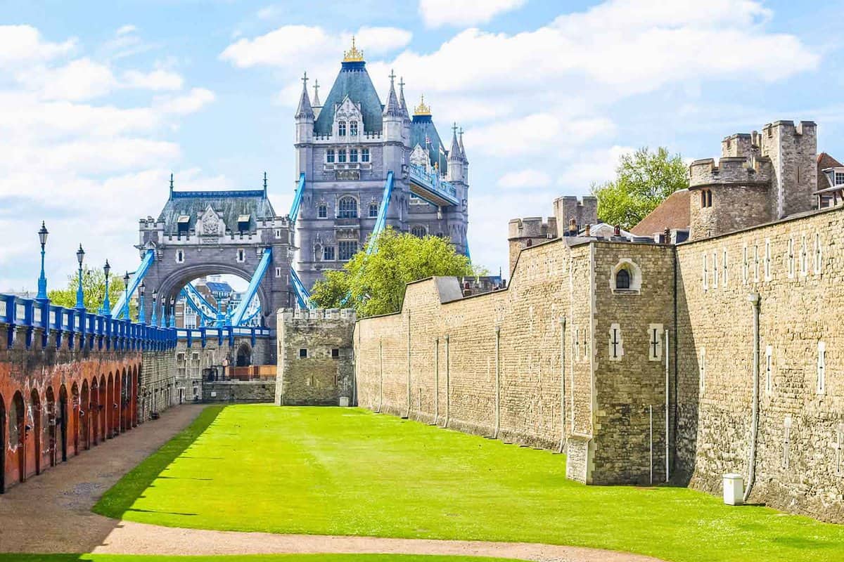 View of London Tower Bridge from the front lawn with tower of london walls next to it