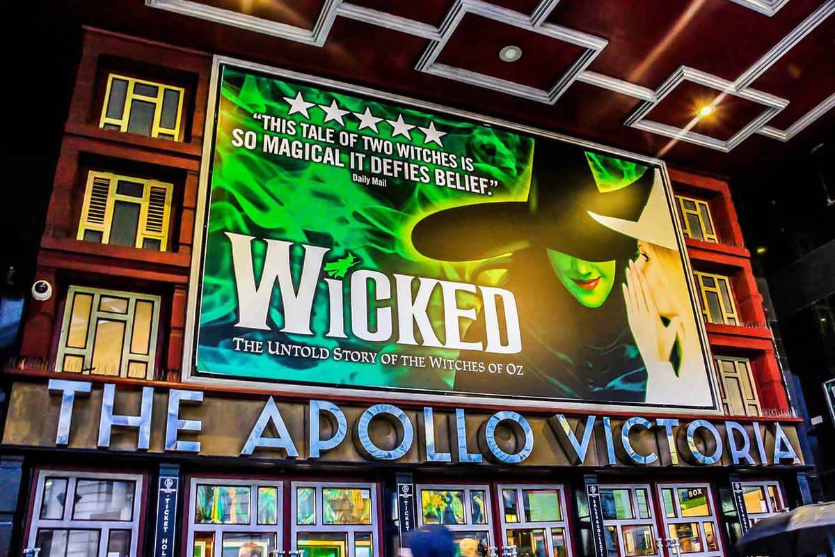 Exterior daytime view of the theatre showing 'Wicked' inside