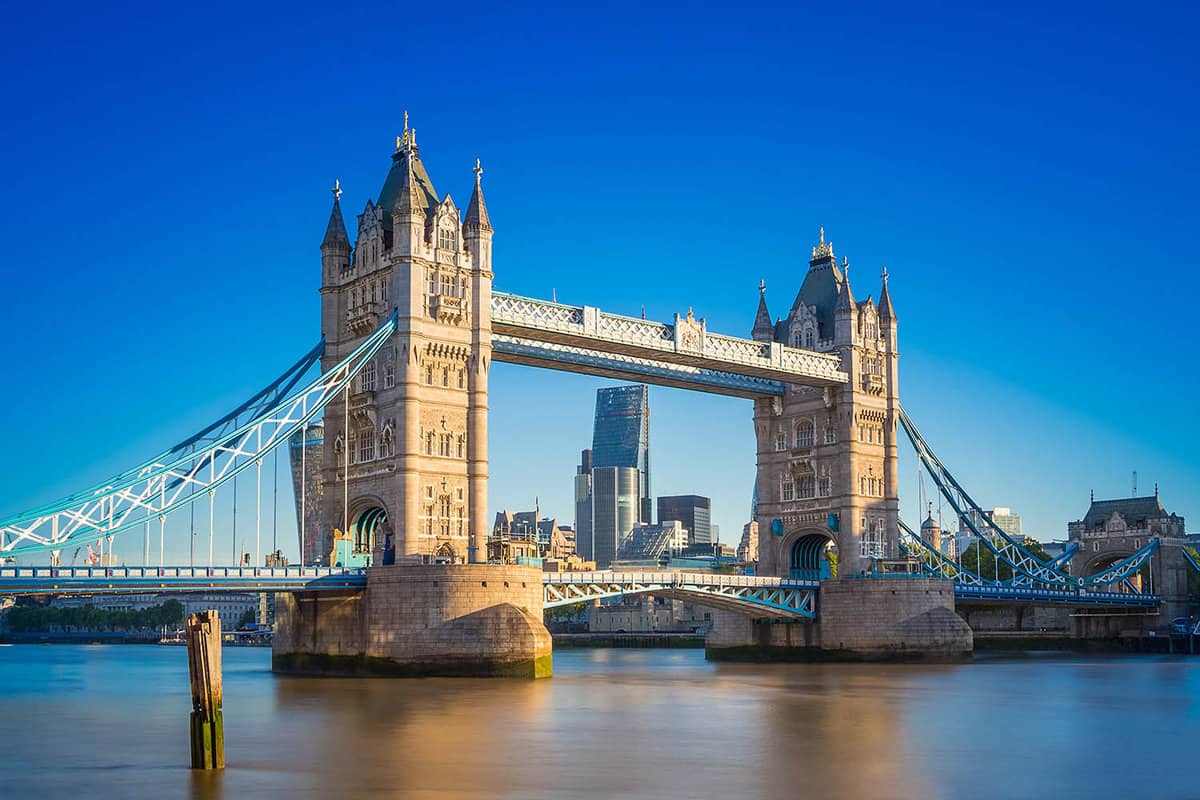 View of tower bridge on a sunny day, with City of London behind