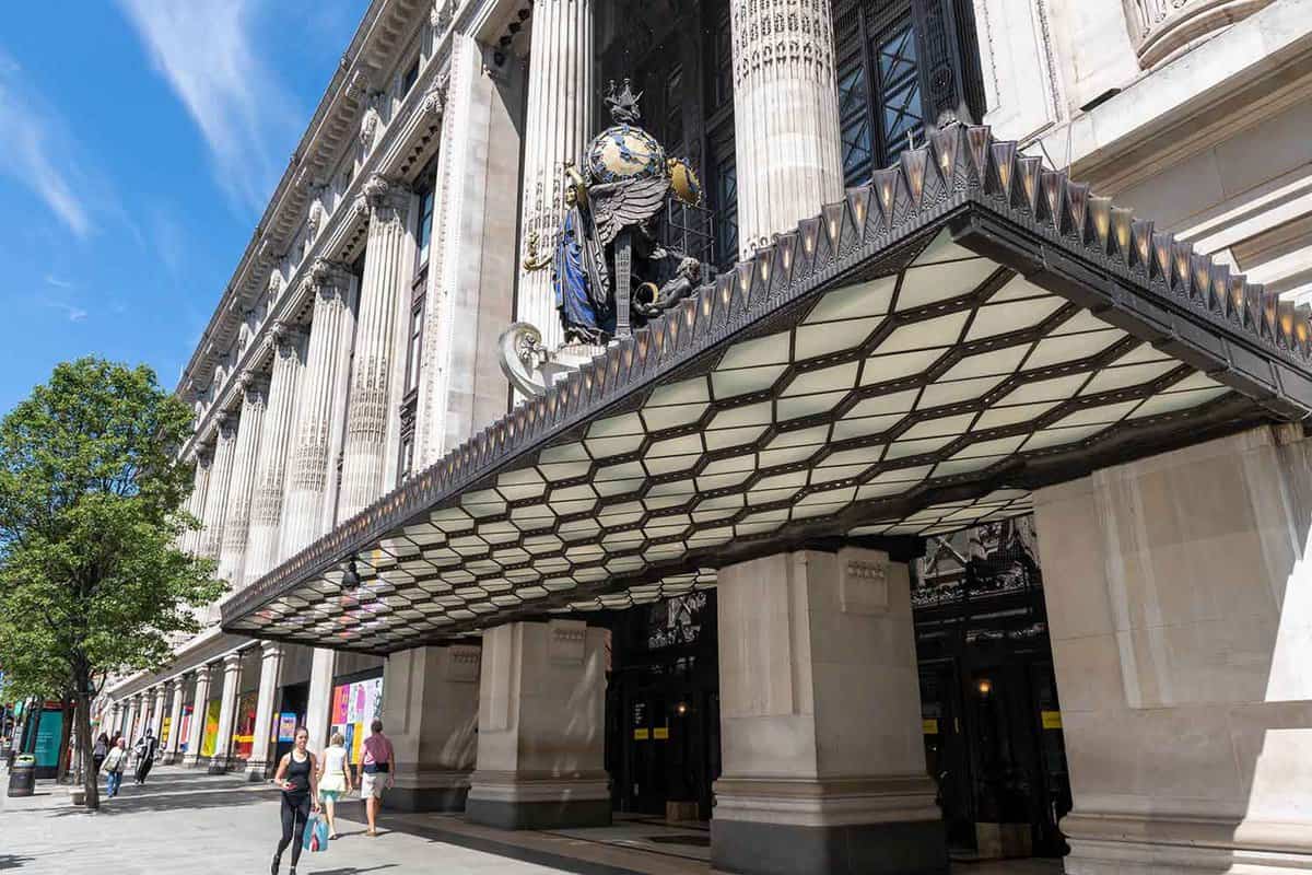 Street view of the front entrance with a large art deco awning
