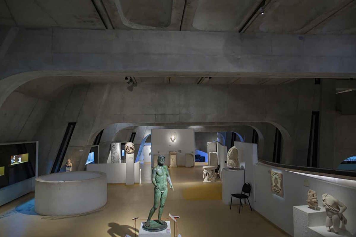 Exhibits on display, including a life sized green statue