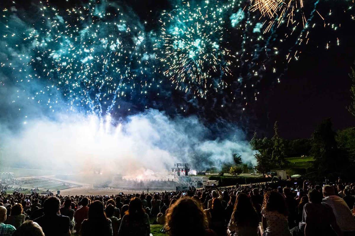 A fireworks display in Parque Tierno Galvan with a crowd of people watching.