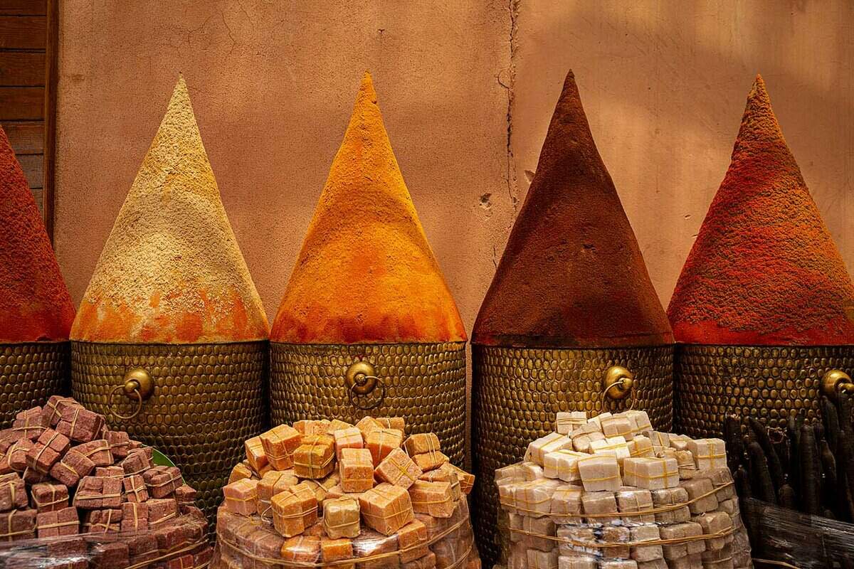 Triangular piles of spices for sale at a Moroccan market