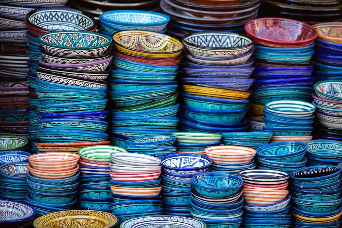 Stacks of brightly-coloured ceramic bowls in a range of sizes