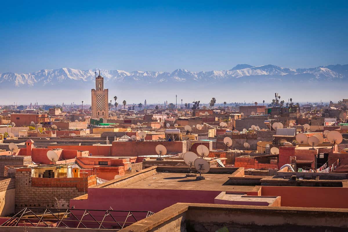 Panoramic view of Marrakech with the snow-capped Atlas Mountains in the background