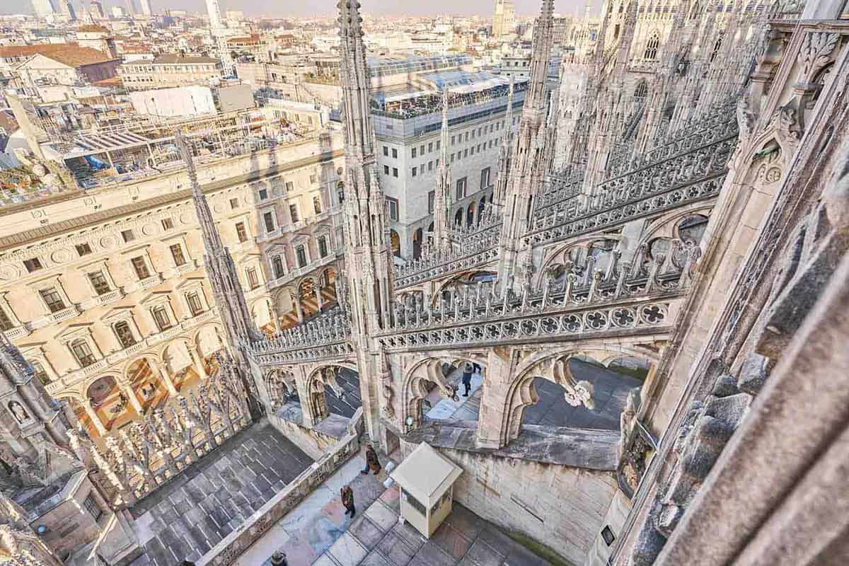 Amazing view of old Gothic spires. Milan Cathedral roof on sunny day, Italy. Milan Cathedral or Duomo di Milano is top tourist attraction of Milan.