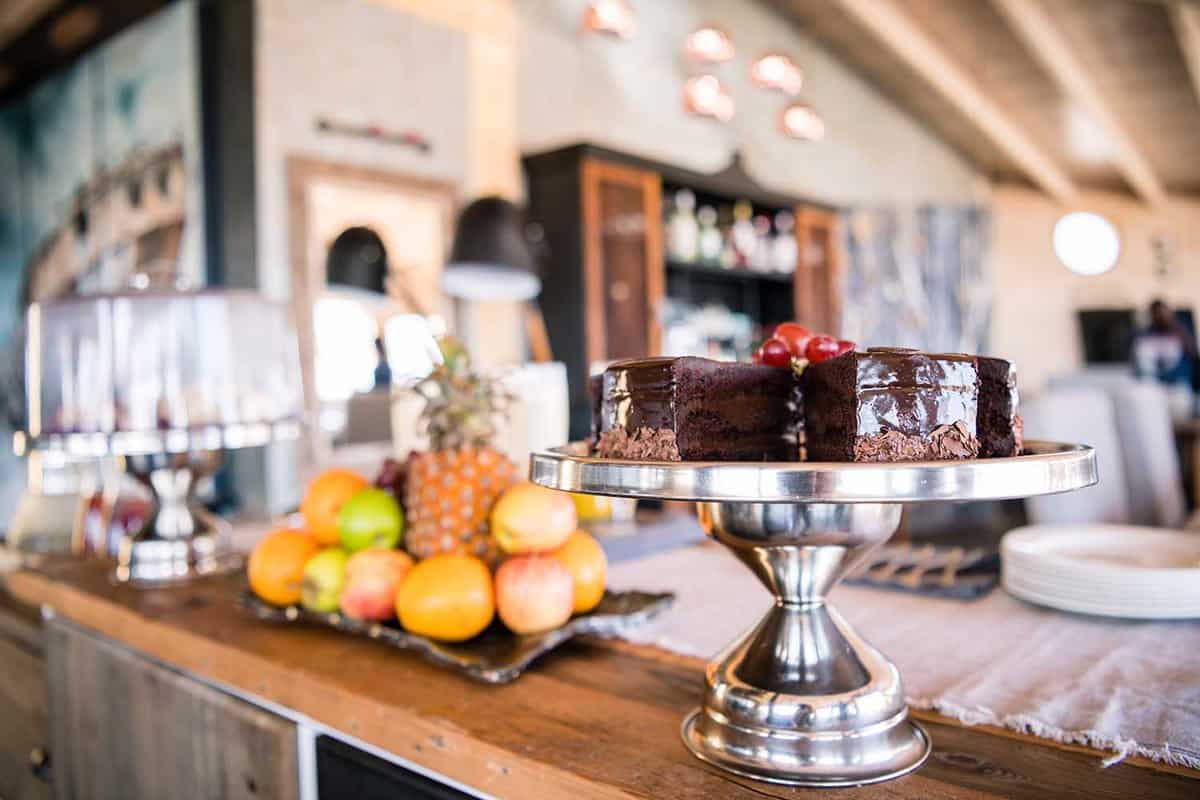 Chocolate cake and fruit on the wooden bar