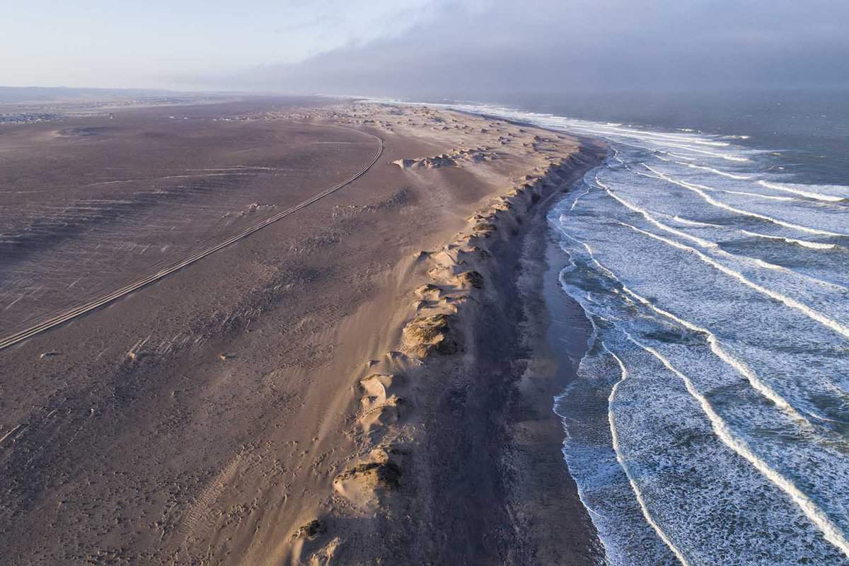 an arial shot of the skeleton coast meeting the sea