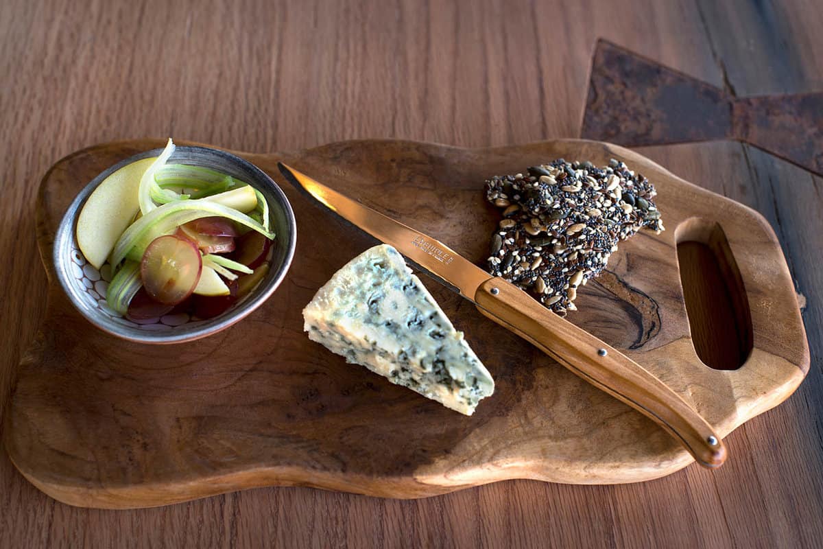 A cheese board on a wooden board