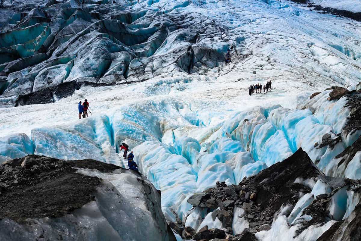 Tourists hiking on the Franz Josef glacier