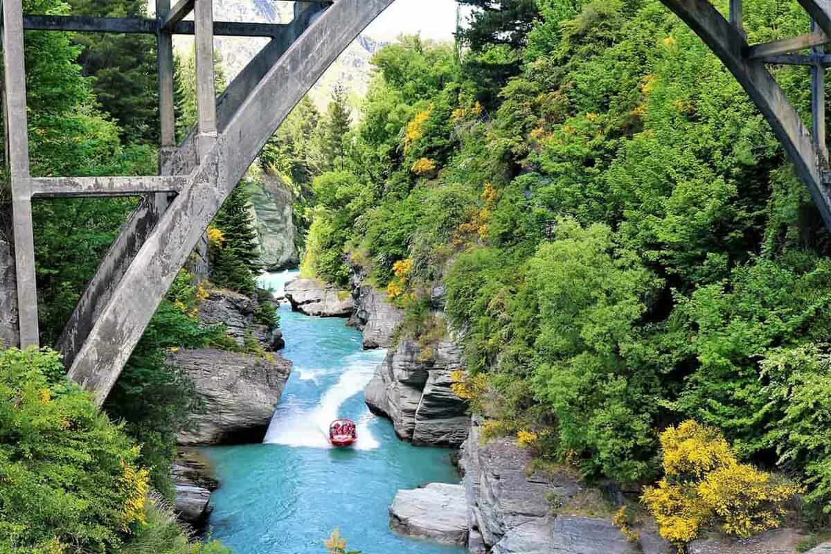 Photo taken at the Shotover river with the jet boat ride in a gatorade blue color water.