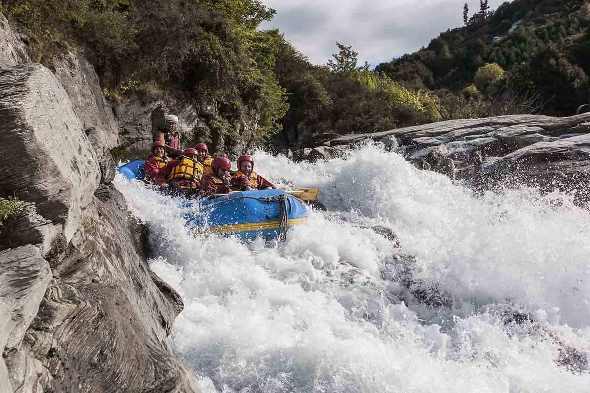 Raft about to go down a churning rapid