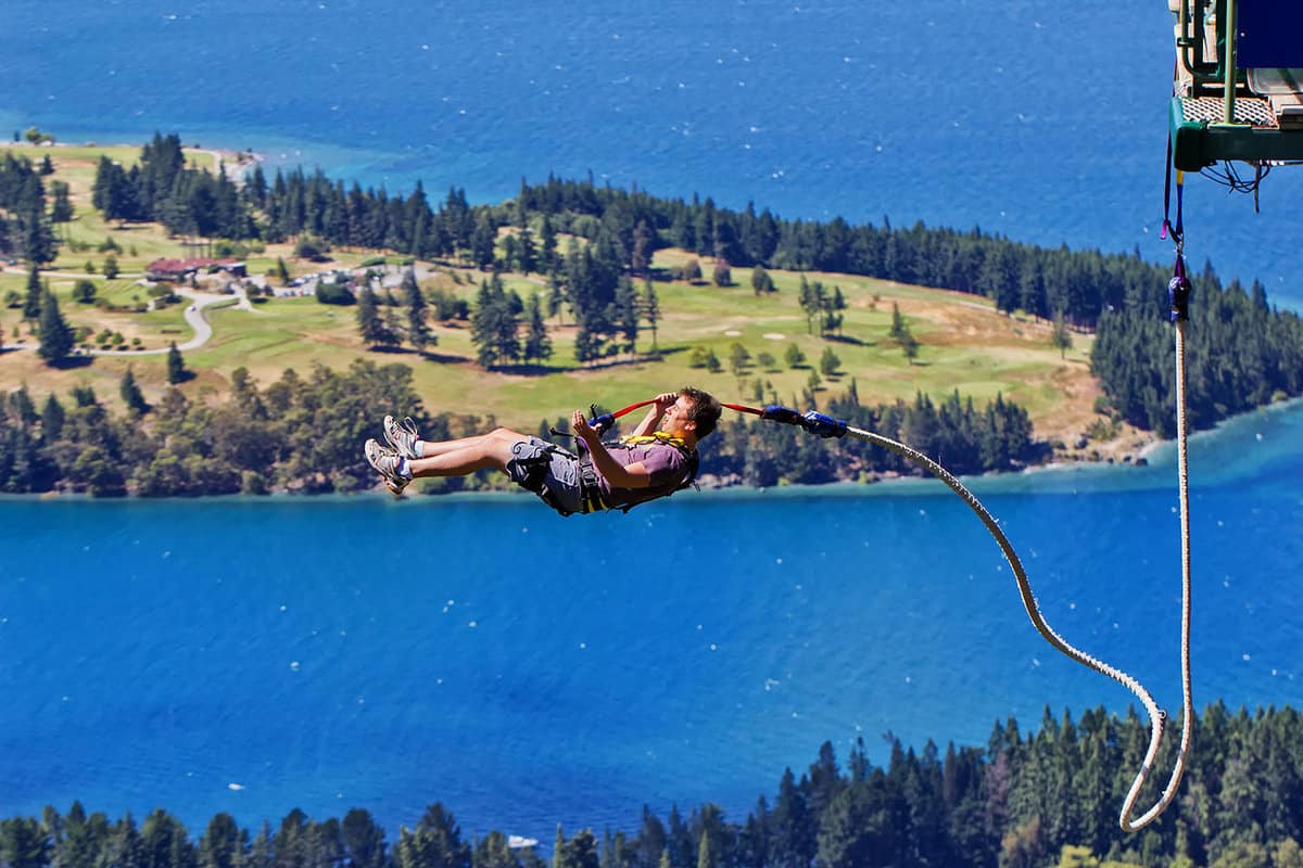 a tourist braves the Ledge Bungy. Situated 400m above the town, the popular attraction offers night jumps.