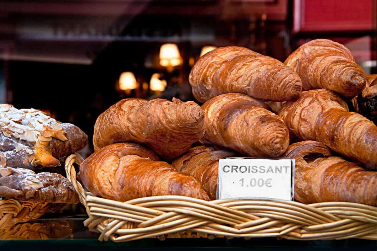 Pile of croissants on a counter