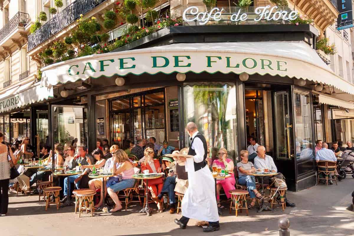 People at the busy Cafe de Flore in Saint-Germain-des-Pres