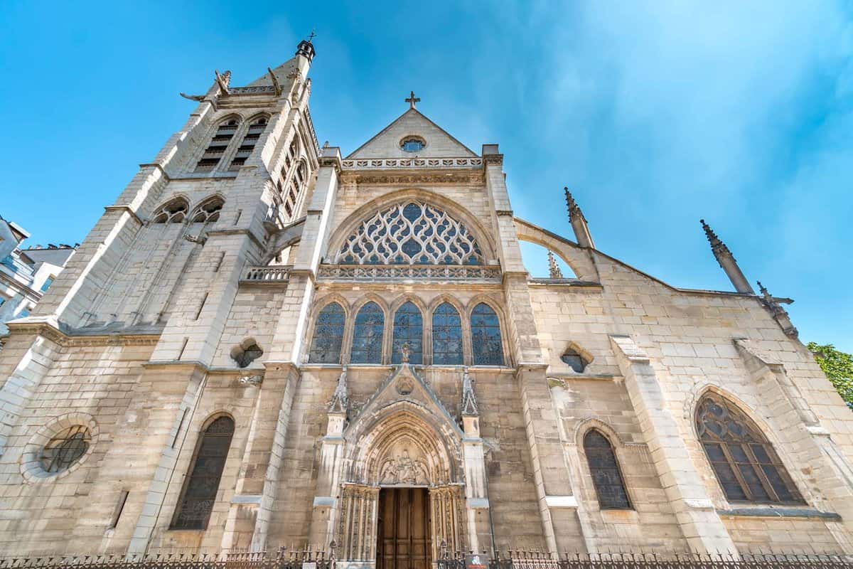 Wide view of facade of medieval Church of Saint-Severin on a sunny blue day