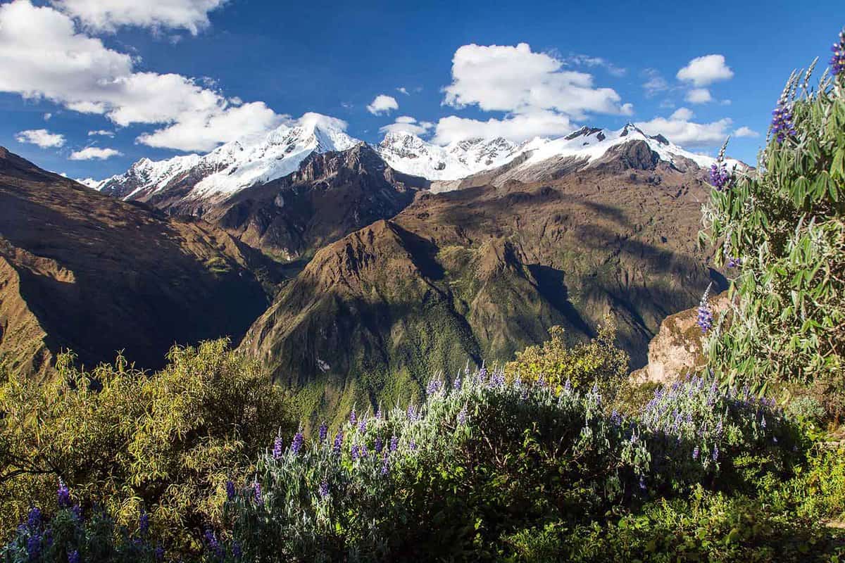 Mount Saksarayuq mountain with blue sky and clouds