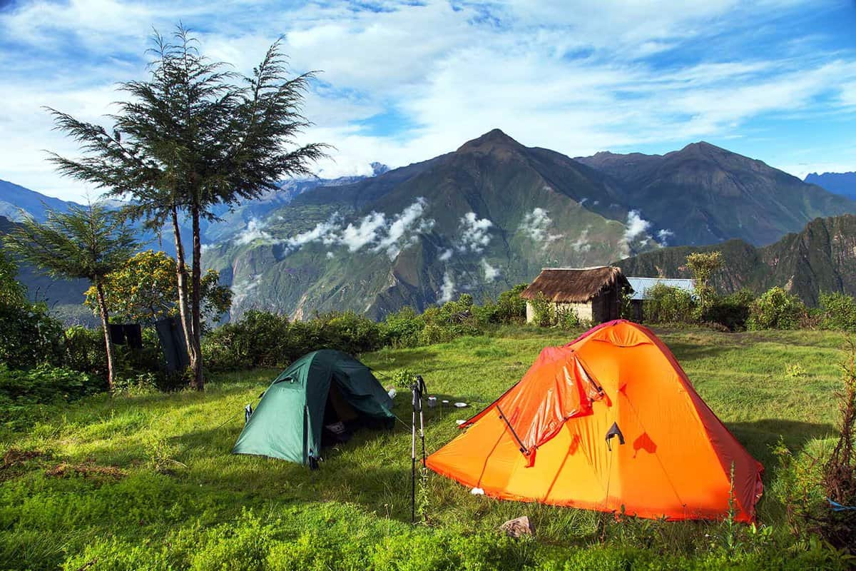 Camp site with two tents, and a view from Choquequirao trekking trail