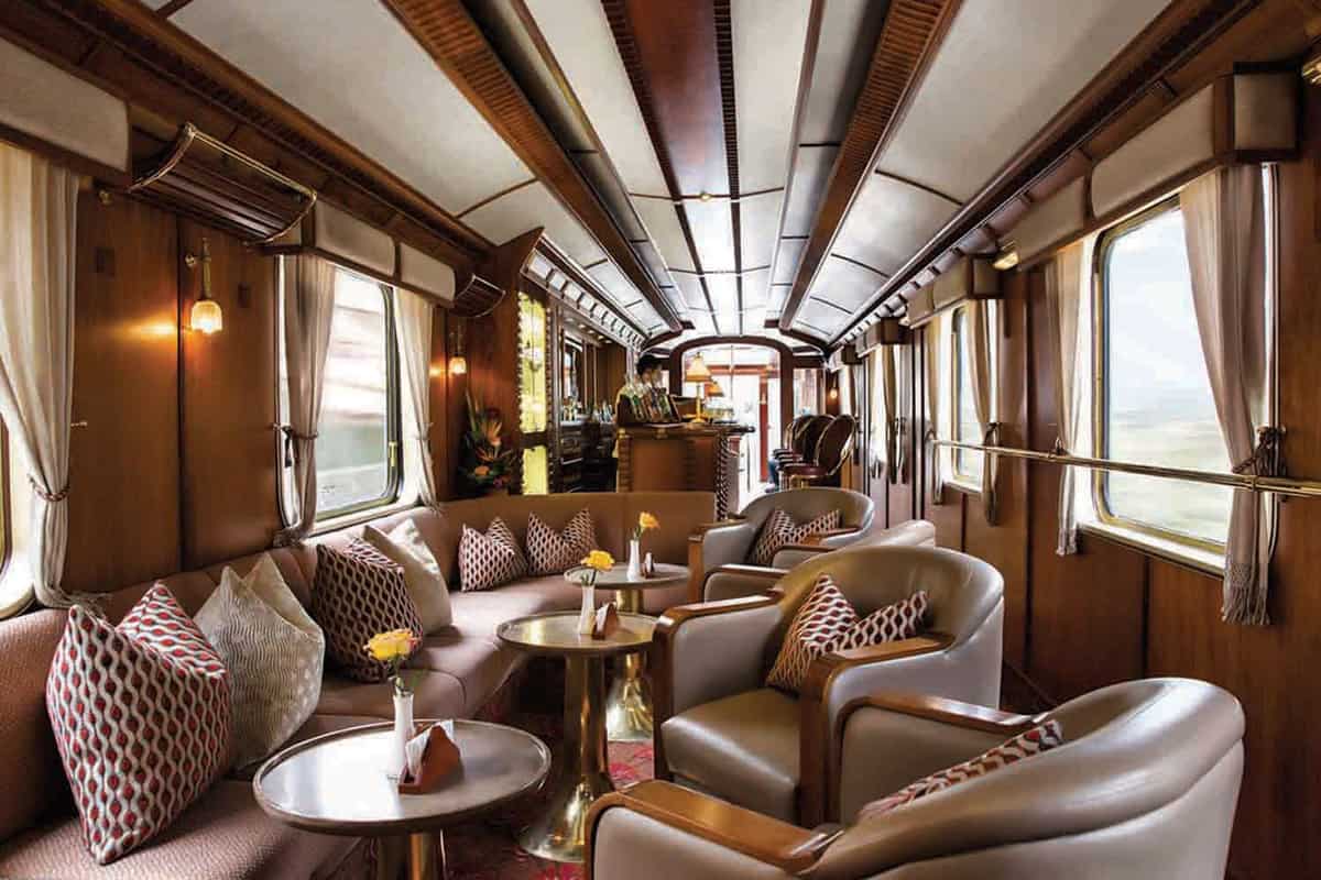 A lounge carriage with leather armchairs and coffee tables
