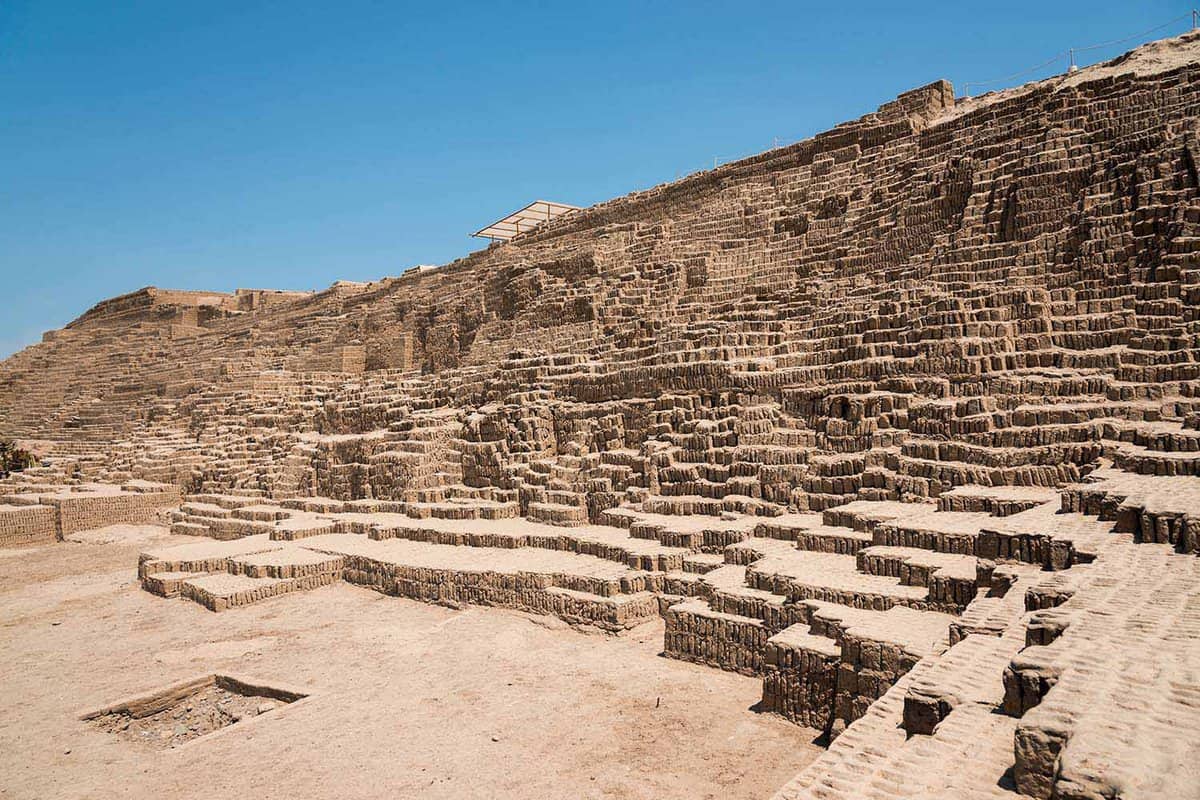A large adobe and clay pyramid made of individual bricks