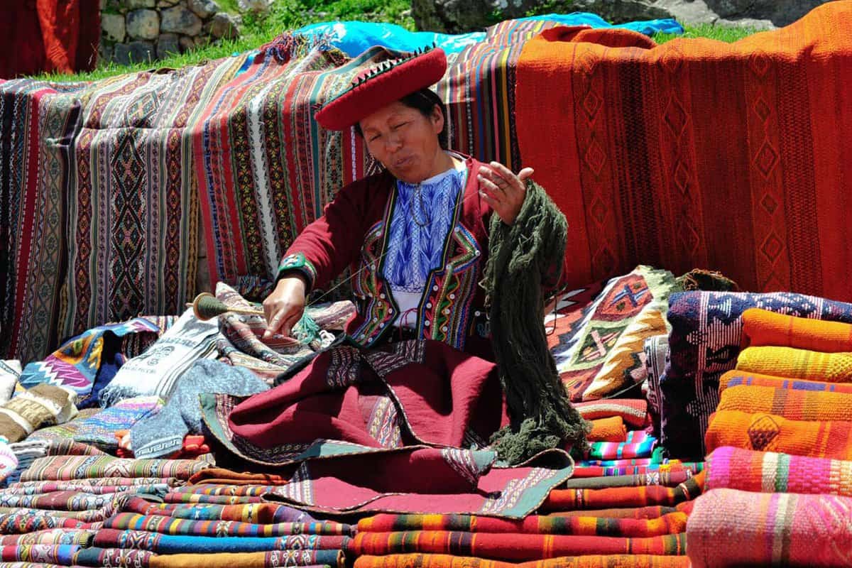Woman selling woven rugs in the market