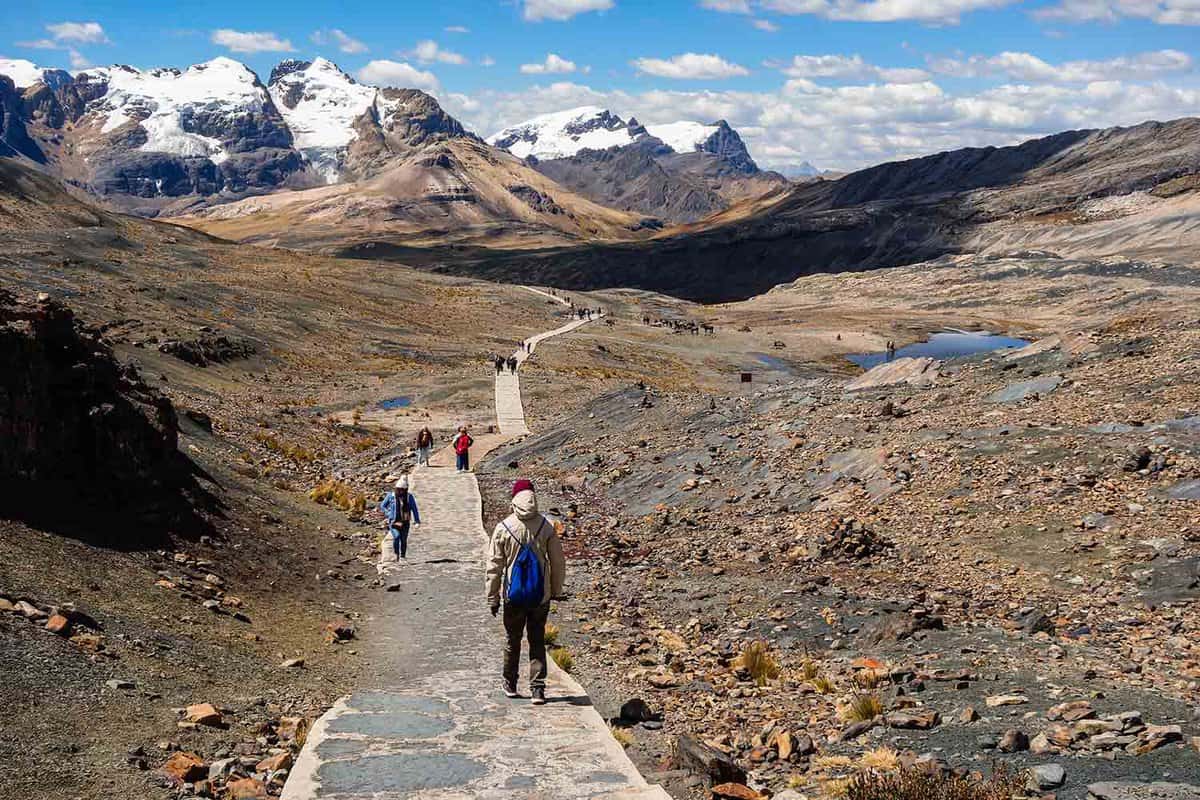 Tourists following the path to Pastoruri Glacier, at Huascaran National Park