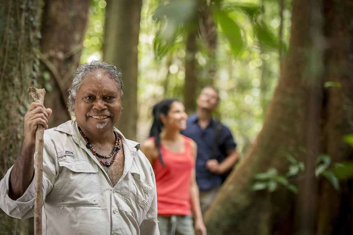 Close up of a local Aboriginal guide with tourists behind