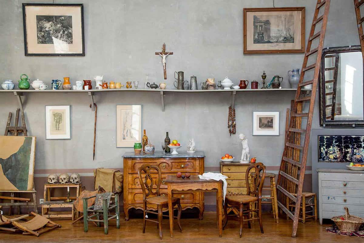 The interior of Cezanne's studio, with art implements and still life objects.