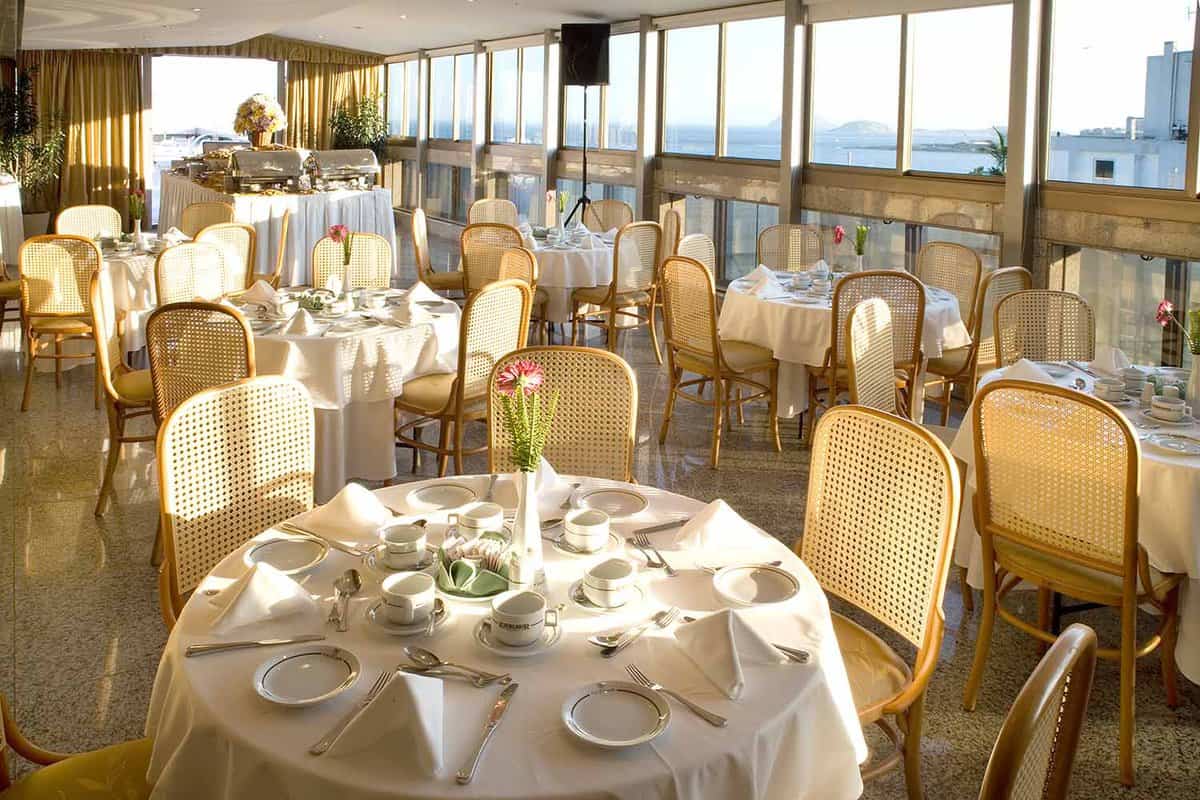 Windows out to sea in large hotel dining room